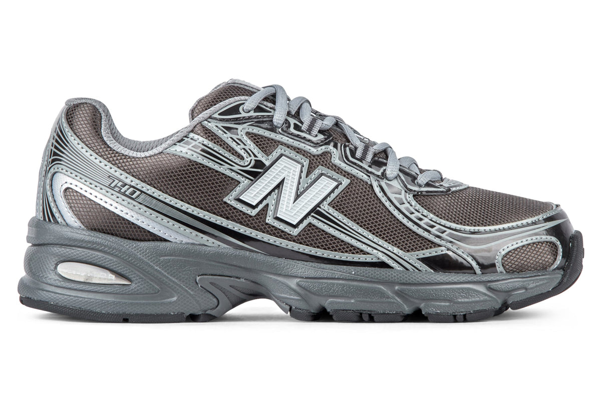 New Balance U7407YI - Castlerock/Black Metallic